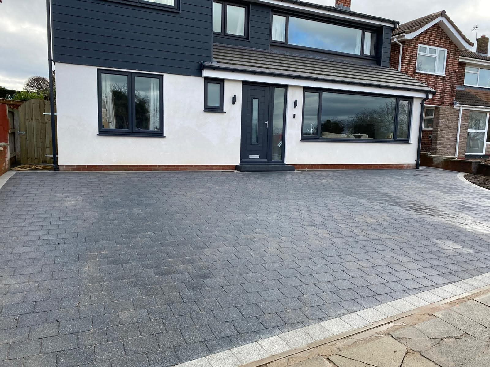 Stretcher bond block paving patio with border detail by E.R.D Paving