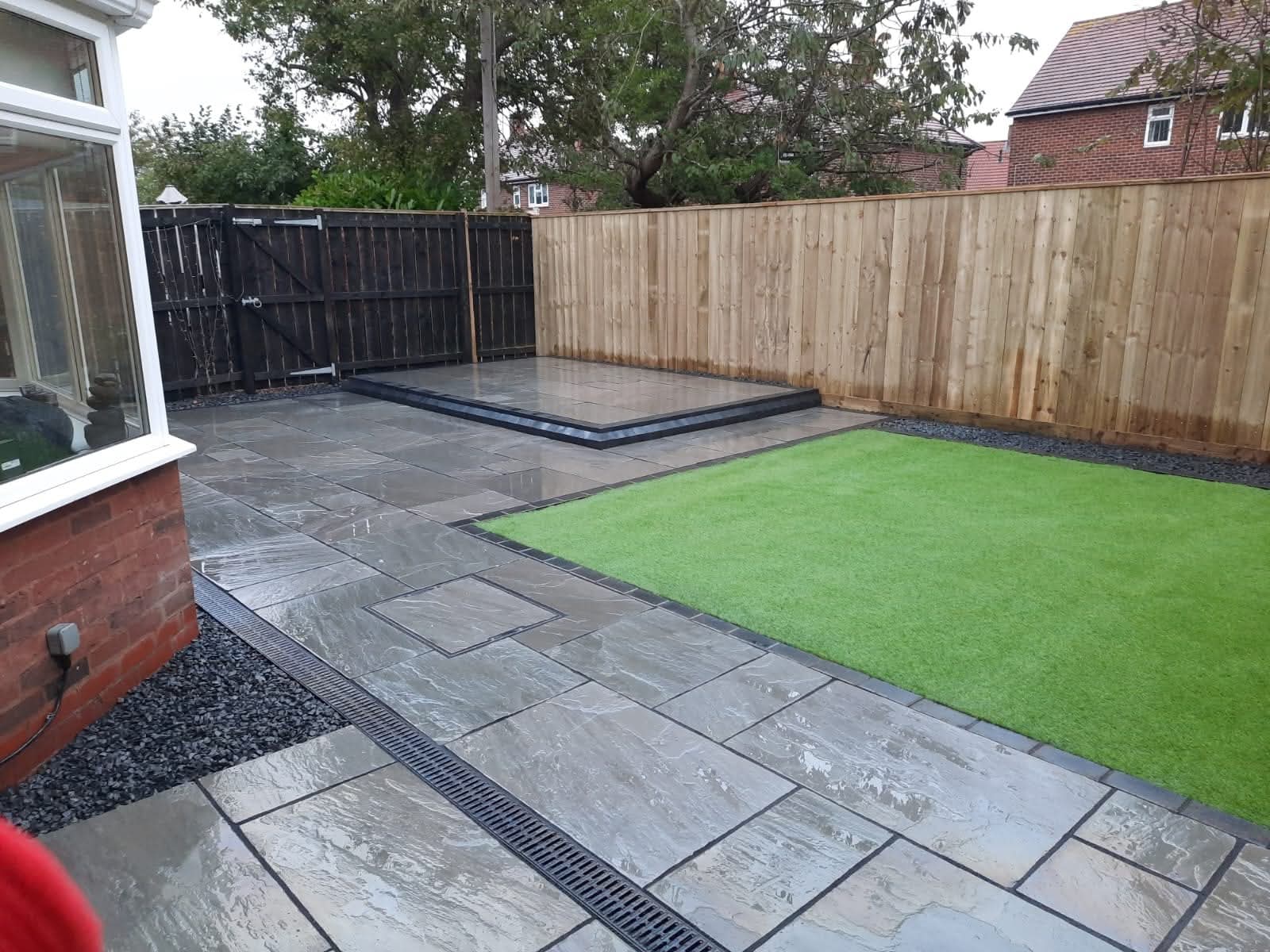 Panel fencing with concrete posts and gravel boards by E.R.D Paving